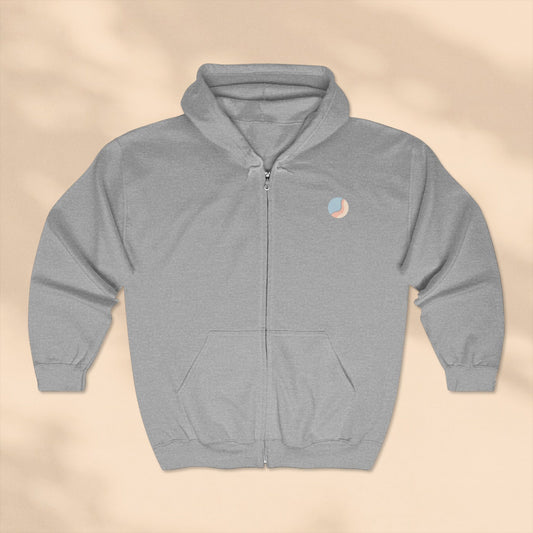 Gray hoodie with a small logo on a beige background