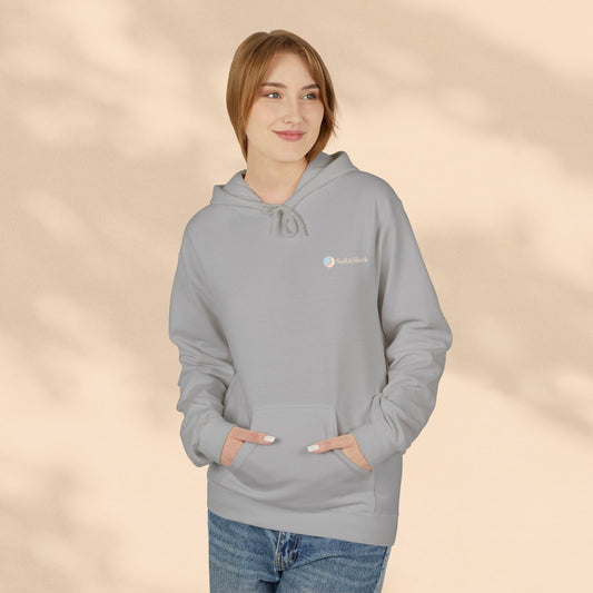 Person wearing a gray hoodie with a logo on a beige background