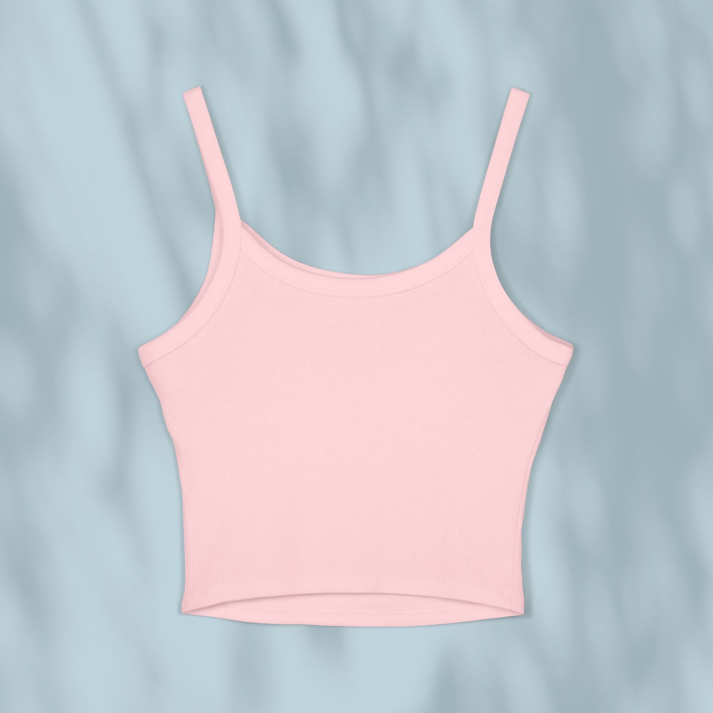 Pink tank top on a light blue background