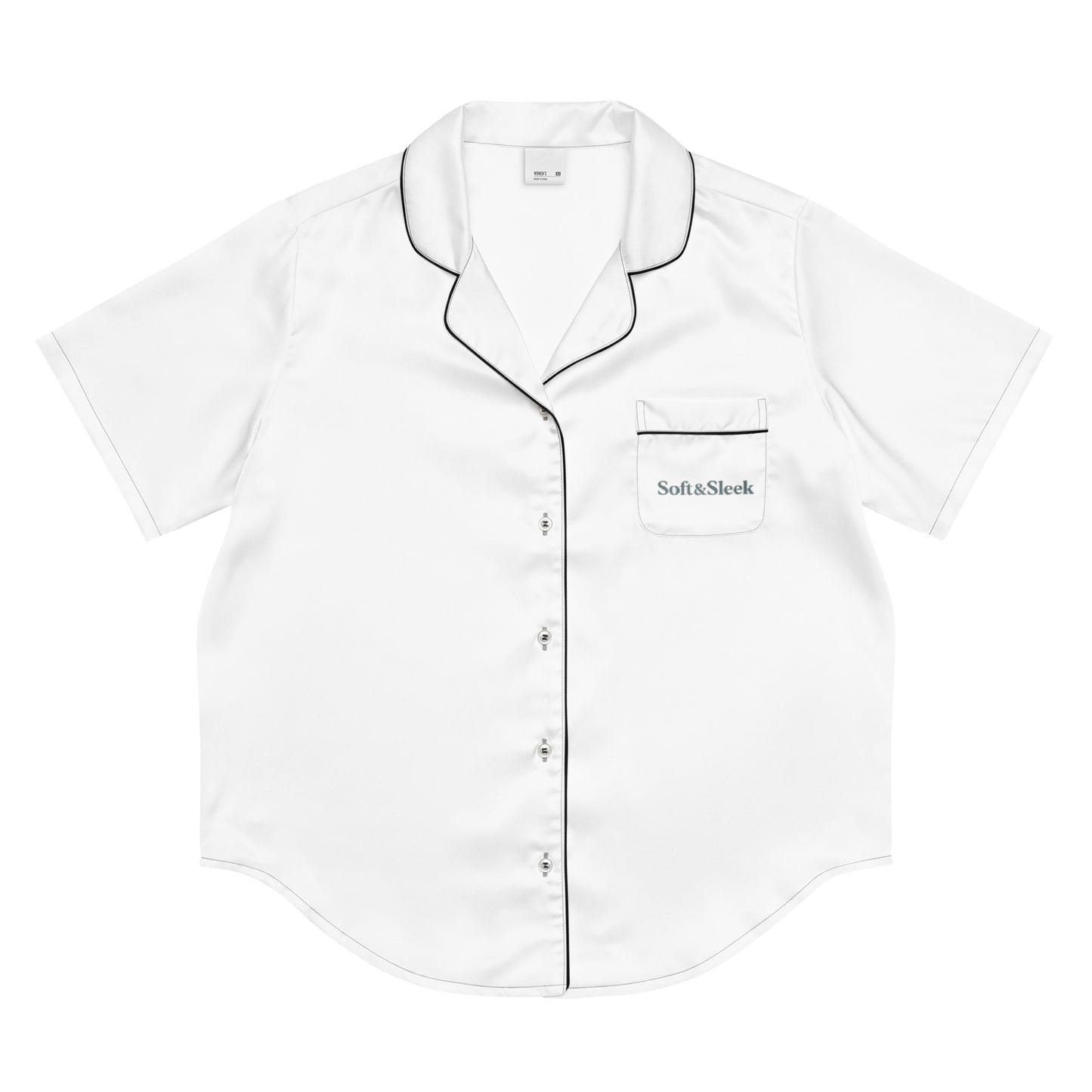 Flat lay of a white Soft & Sleek short-sleeve pyjama shirt with black piping and logo on the chest pocket.