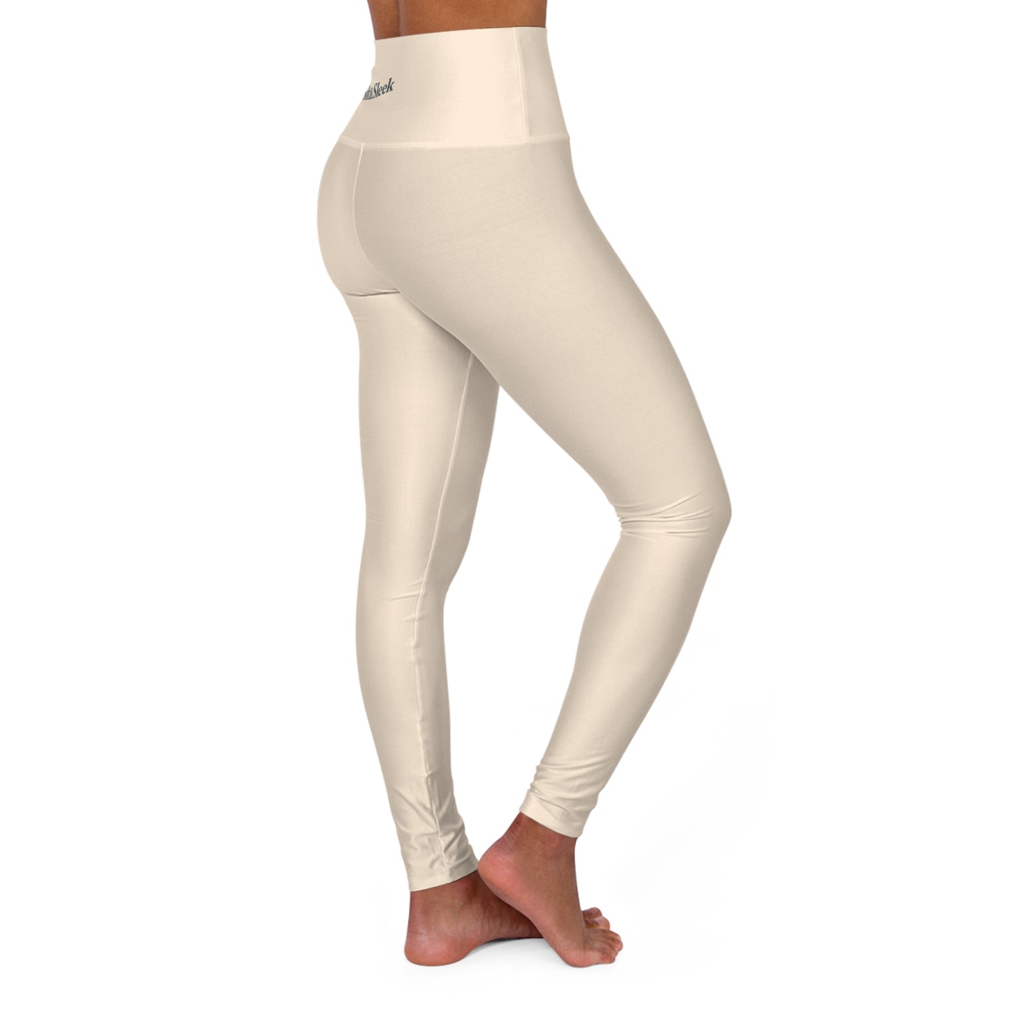 Angled rear-side view of woman wearing cream Soft & Sleek leggings in a turned pose
