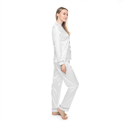 Profile view of woman wearing white Soft & Sleek satin pyjamas, standing against white background.