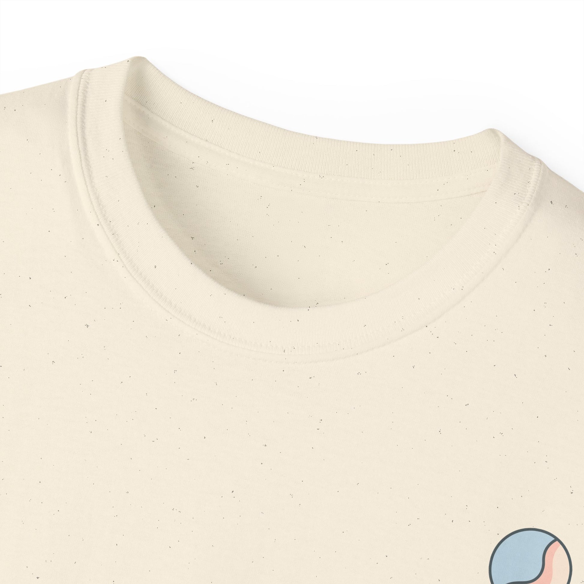 Cream t-shirt neckline close-up with Soft & Sleek emblem