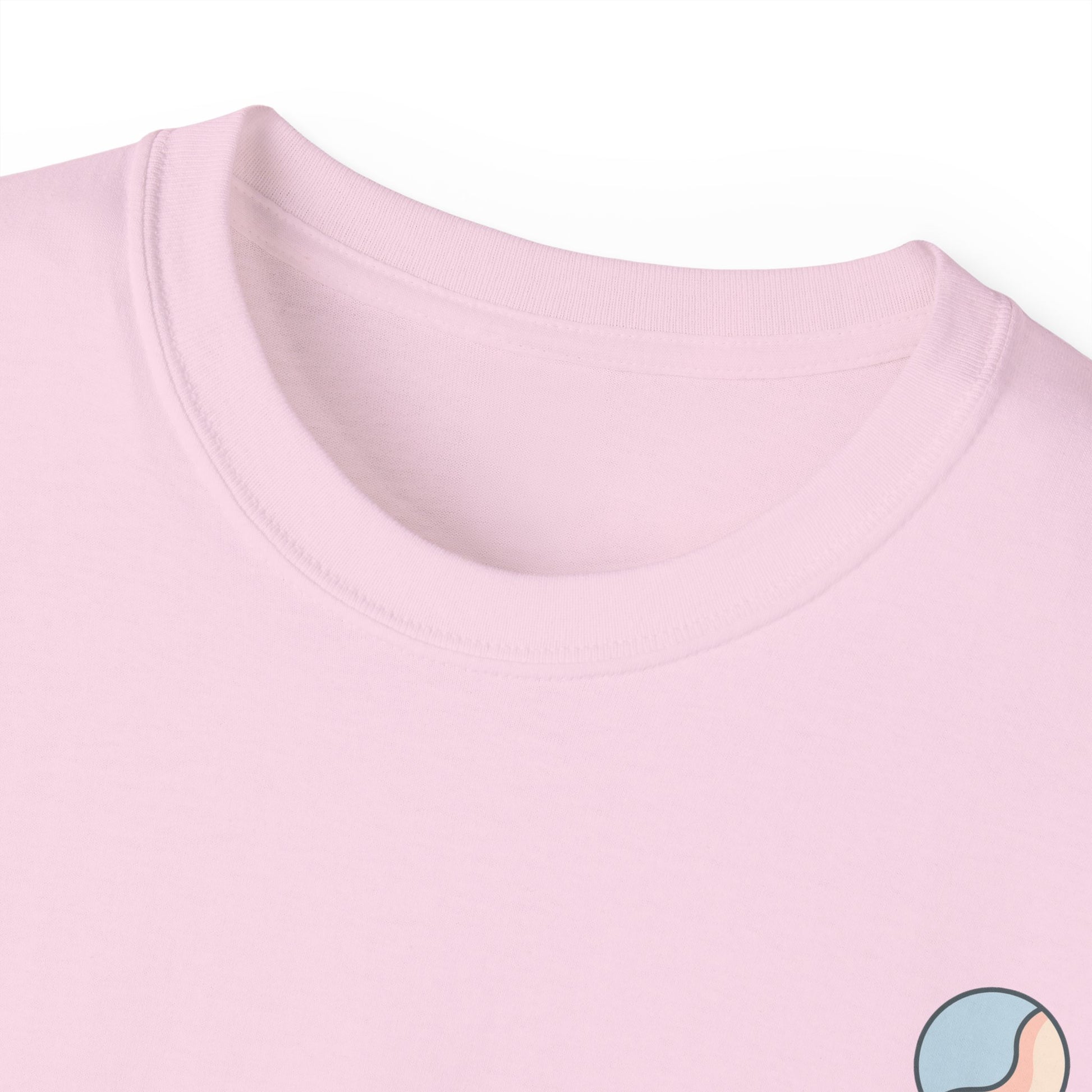 Light pink t-shirt neckline close-up with Soft & Sleek emblem