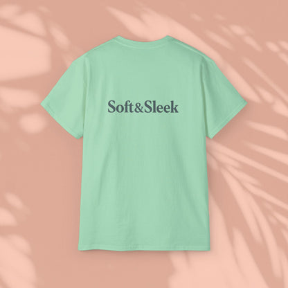 Green Soft & Sleek t-shirt with logo on back, peach background