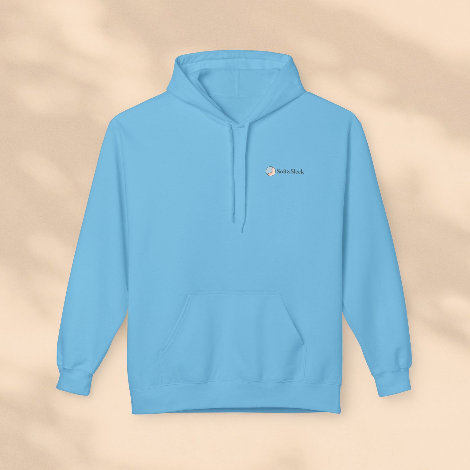 Light blue hoodie with a brand logo on a beige background