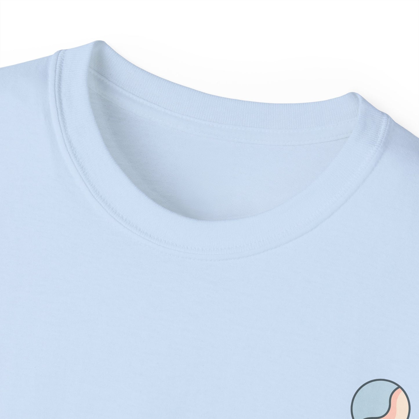 Close-up of a light blue t-shirt with a small logo on the chest.