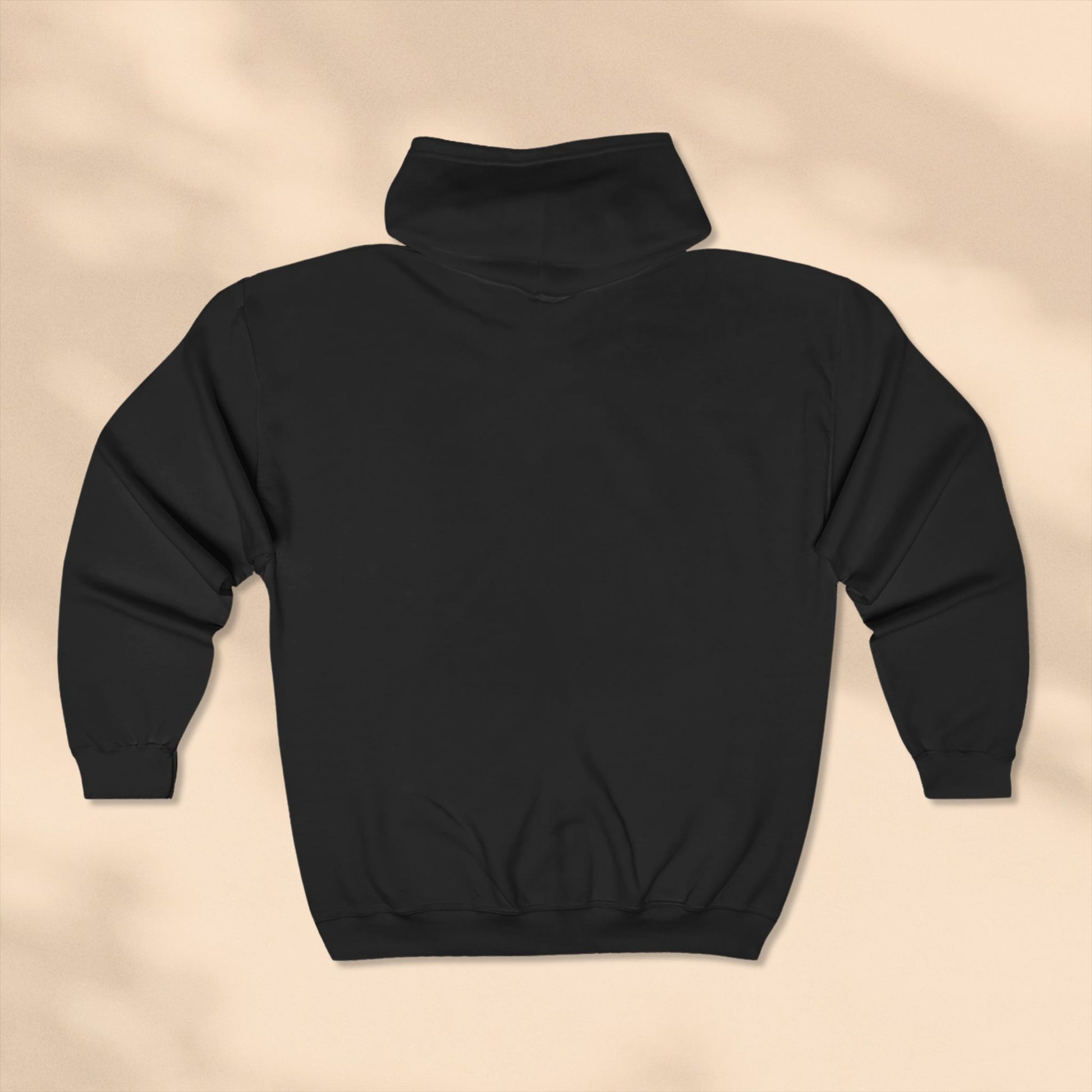 Rear view of Black hoodie on a beige background