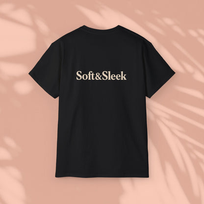Black Soft & Sleek t-shirt with logo on back, peach background