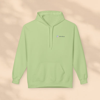 Light green hoodie with a brand logo on a beige background