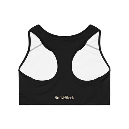 Rear flat lay of black Soft & Sleek sports bra showing racerback design and interior white lining with logo printed on back band.