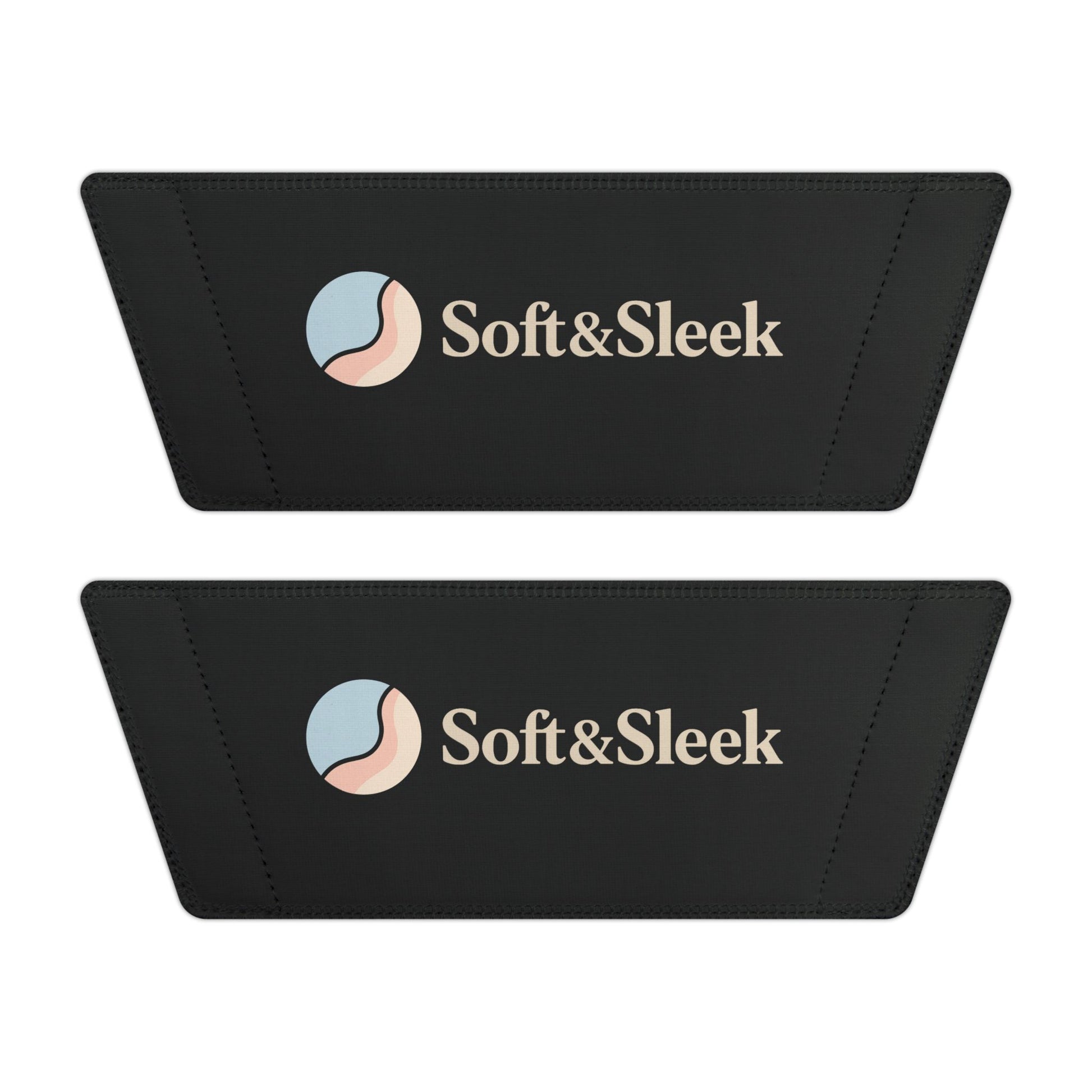 Flat lay of two black Soft & Sleek slide straps showing logo and emblem placement side by side