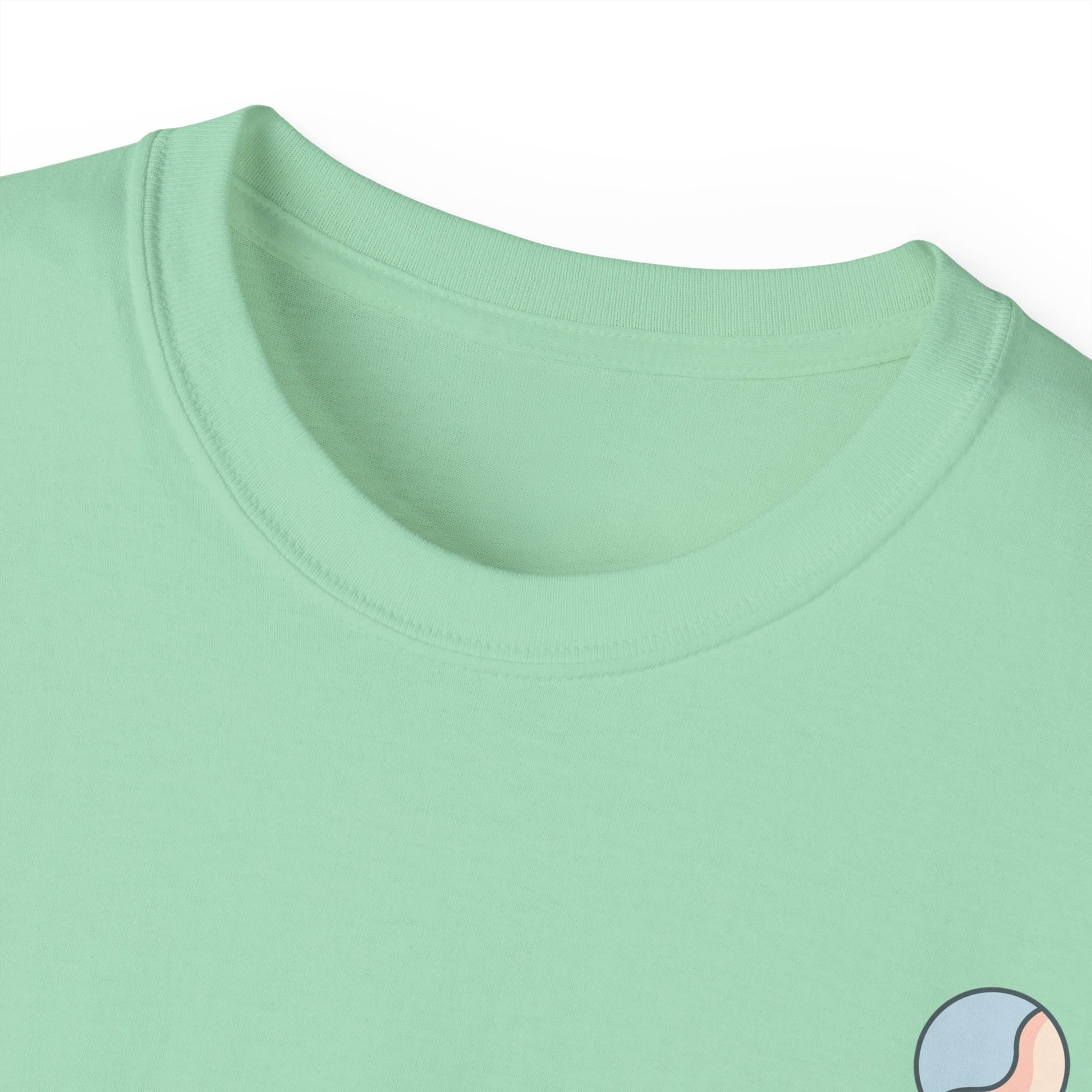 Mint green t-shirt neckline close-up with Soft & Sleek emblem