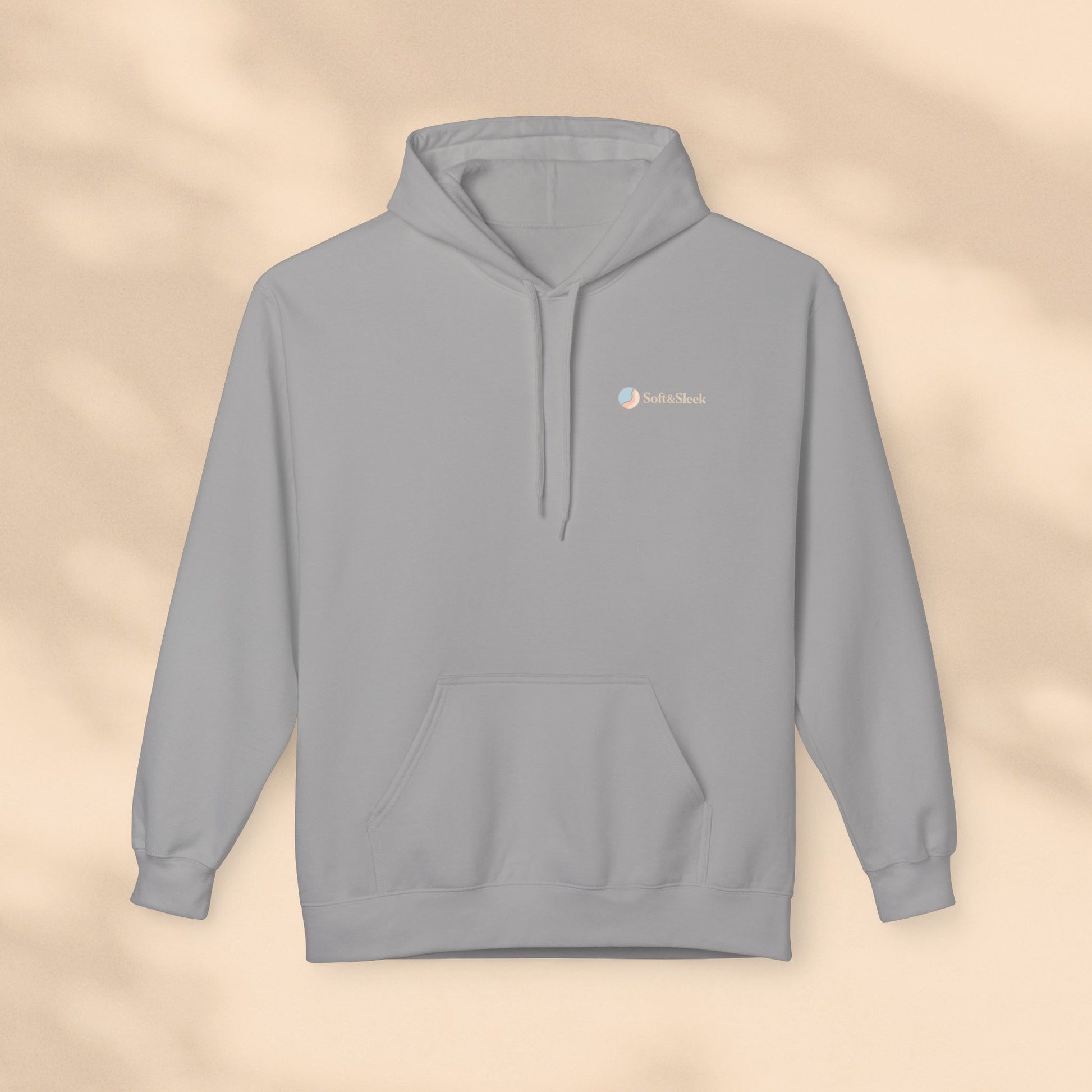 Gray hoodie with a logo on a beige background