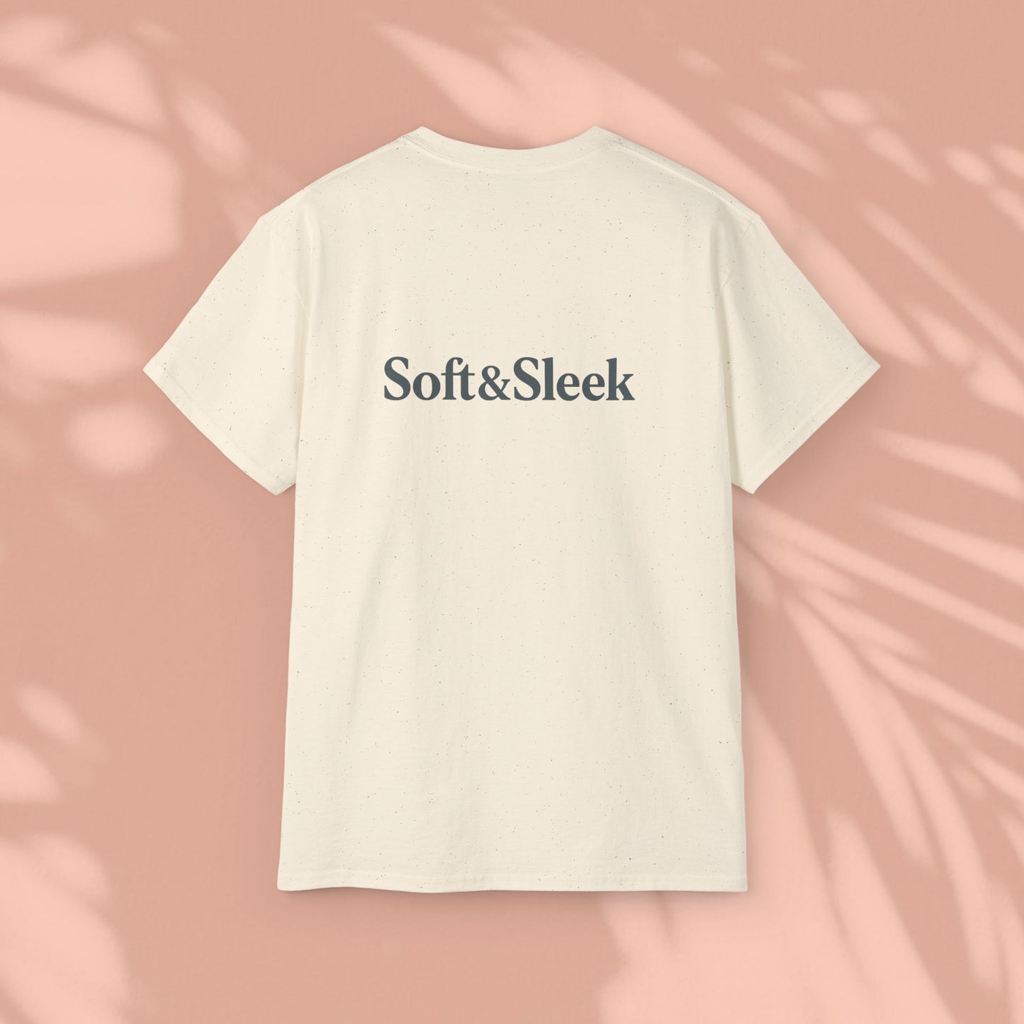 Cream Soft & Sleek t-shirt with logo on back, peach background
