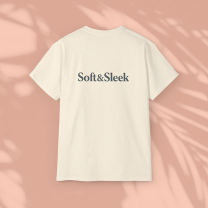 Cream Soft & Sleek t-shirt with logo on back, peach background