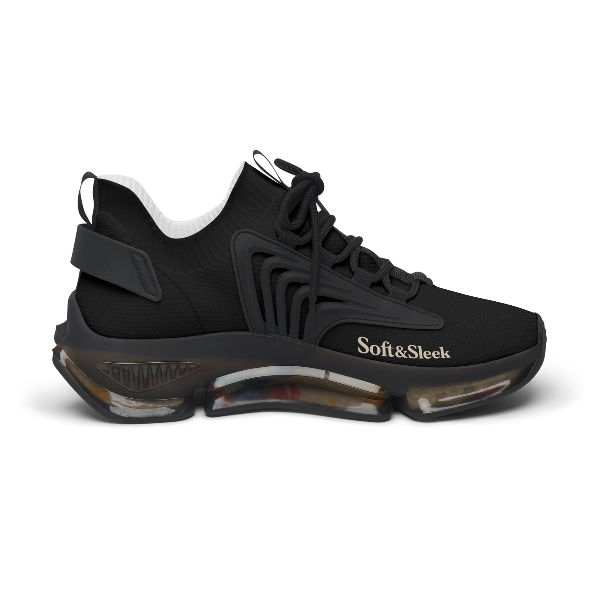 Outer side profile of a single black Soft & Sleek trainer with curved sole detail.