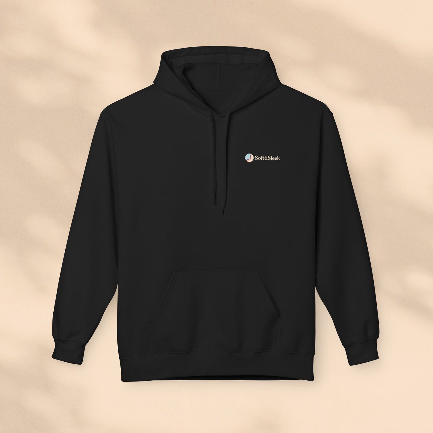 Black hoodie with a logo on a beige background