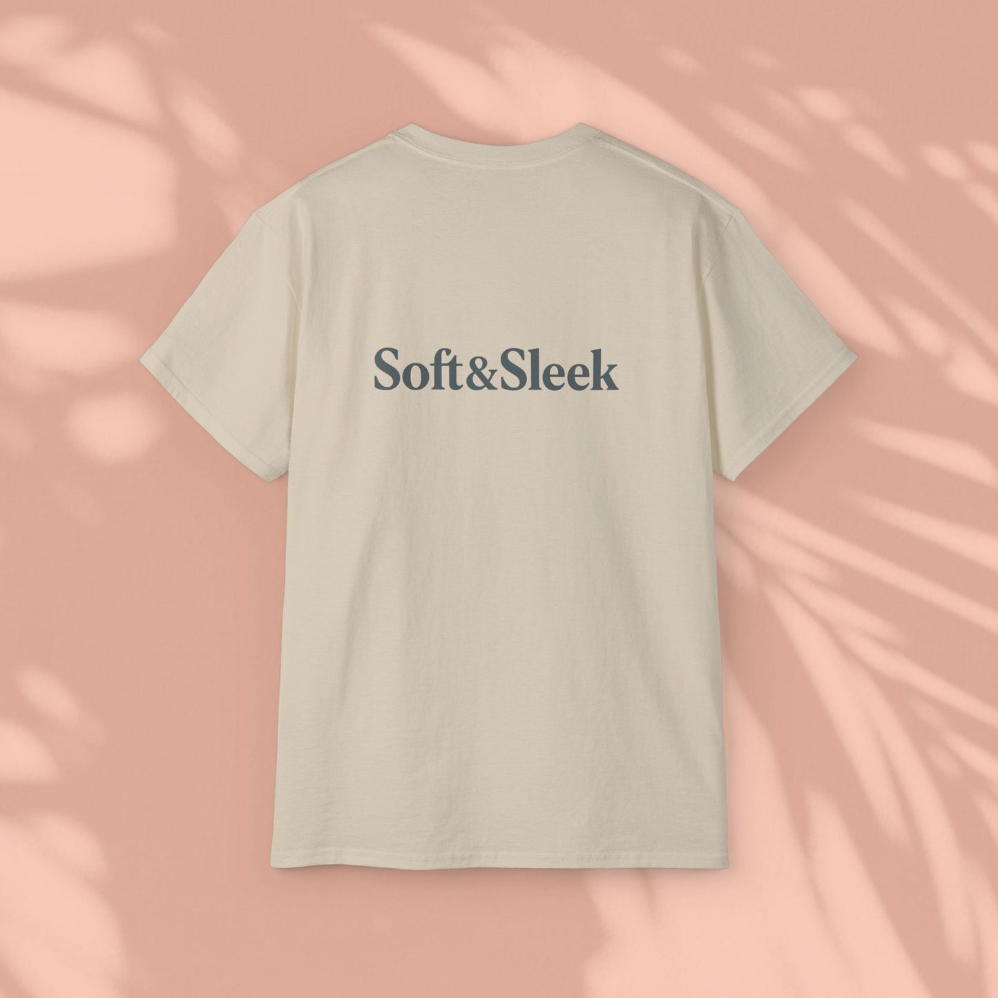 Beige Soft & Sleek t-shirt with logo on back, peach background