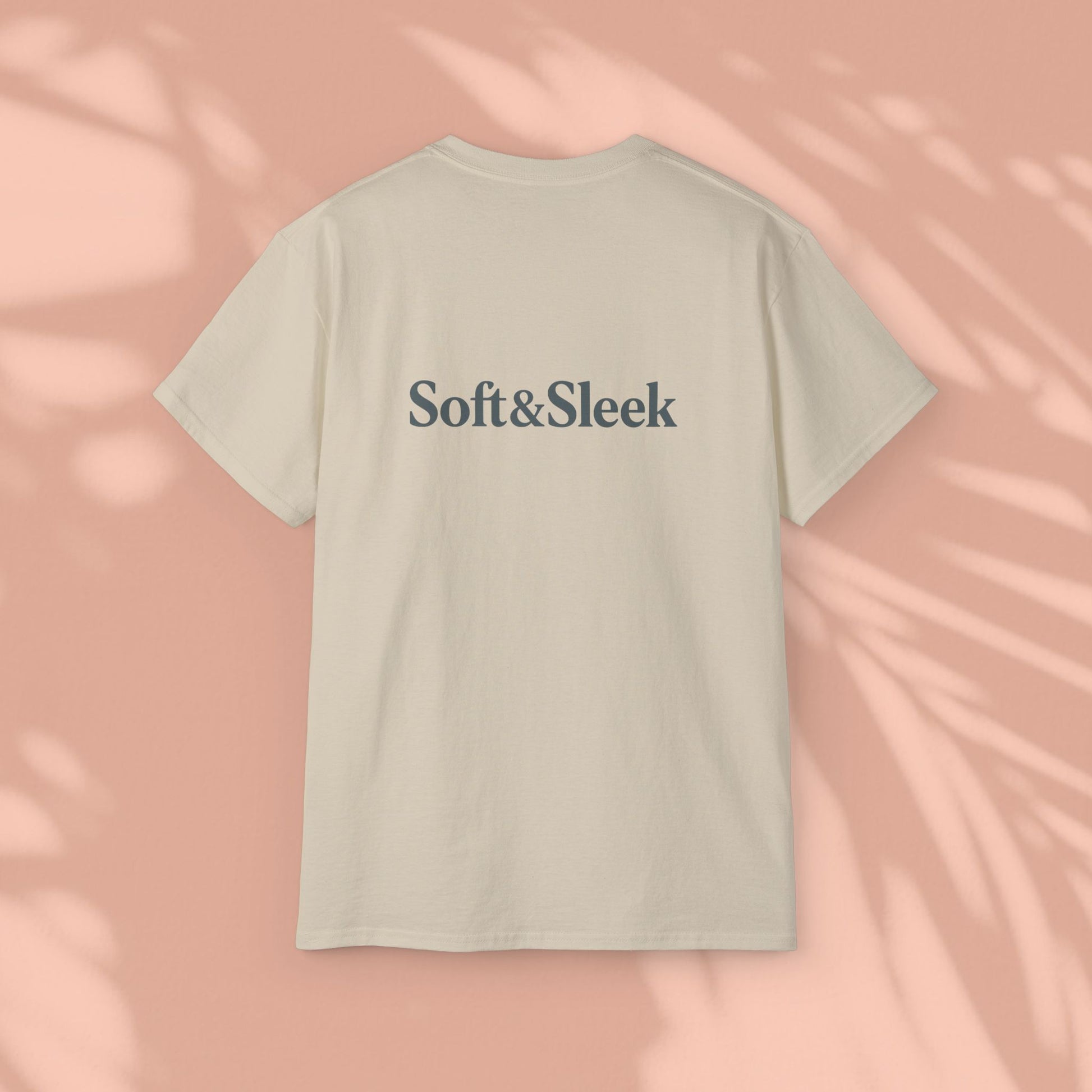 Beige Soft & Sleek t-shirt with logo on back, peach background