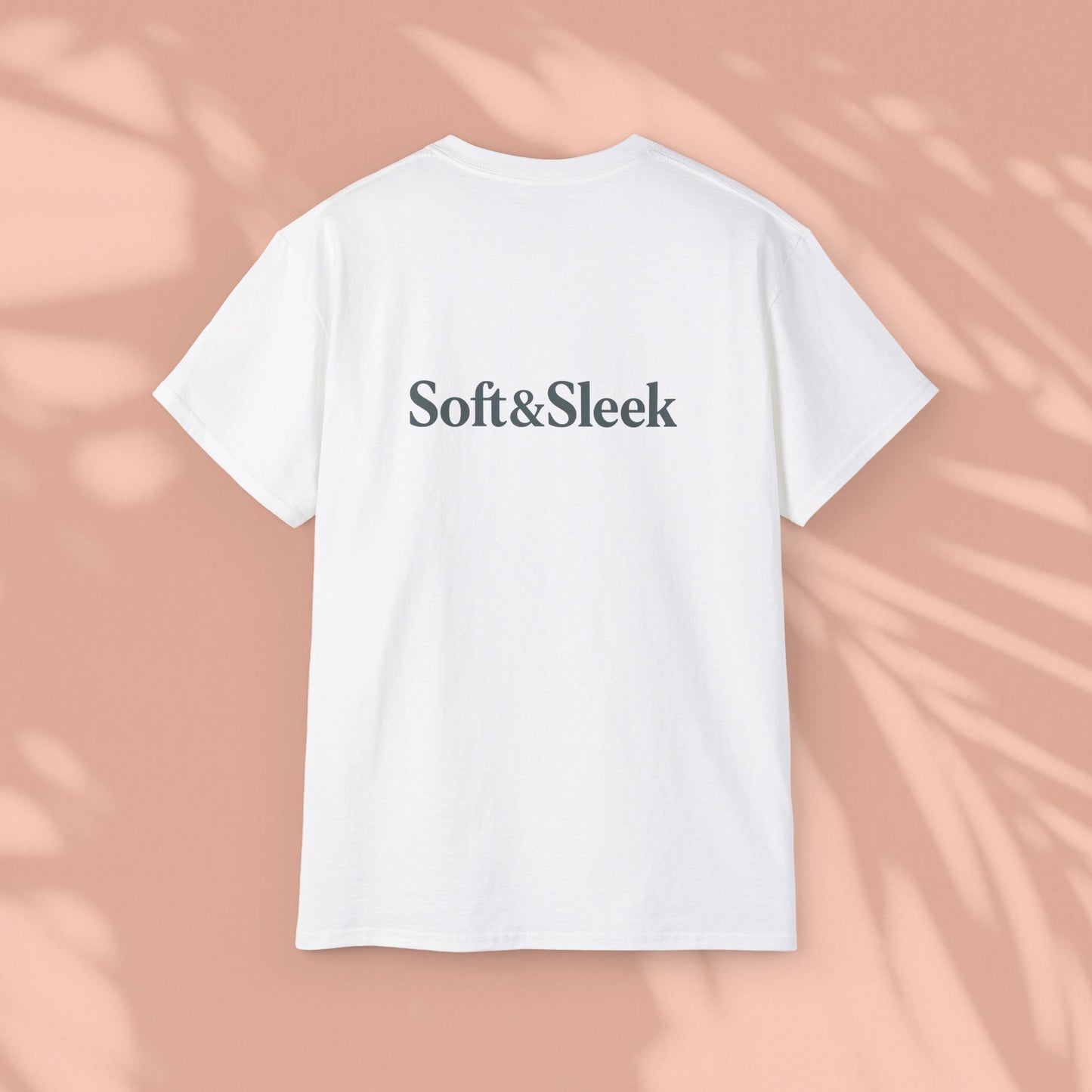 White Soft & Sleek t-shirt with logo on back, peach background
