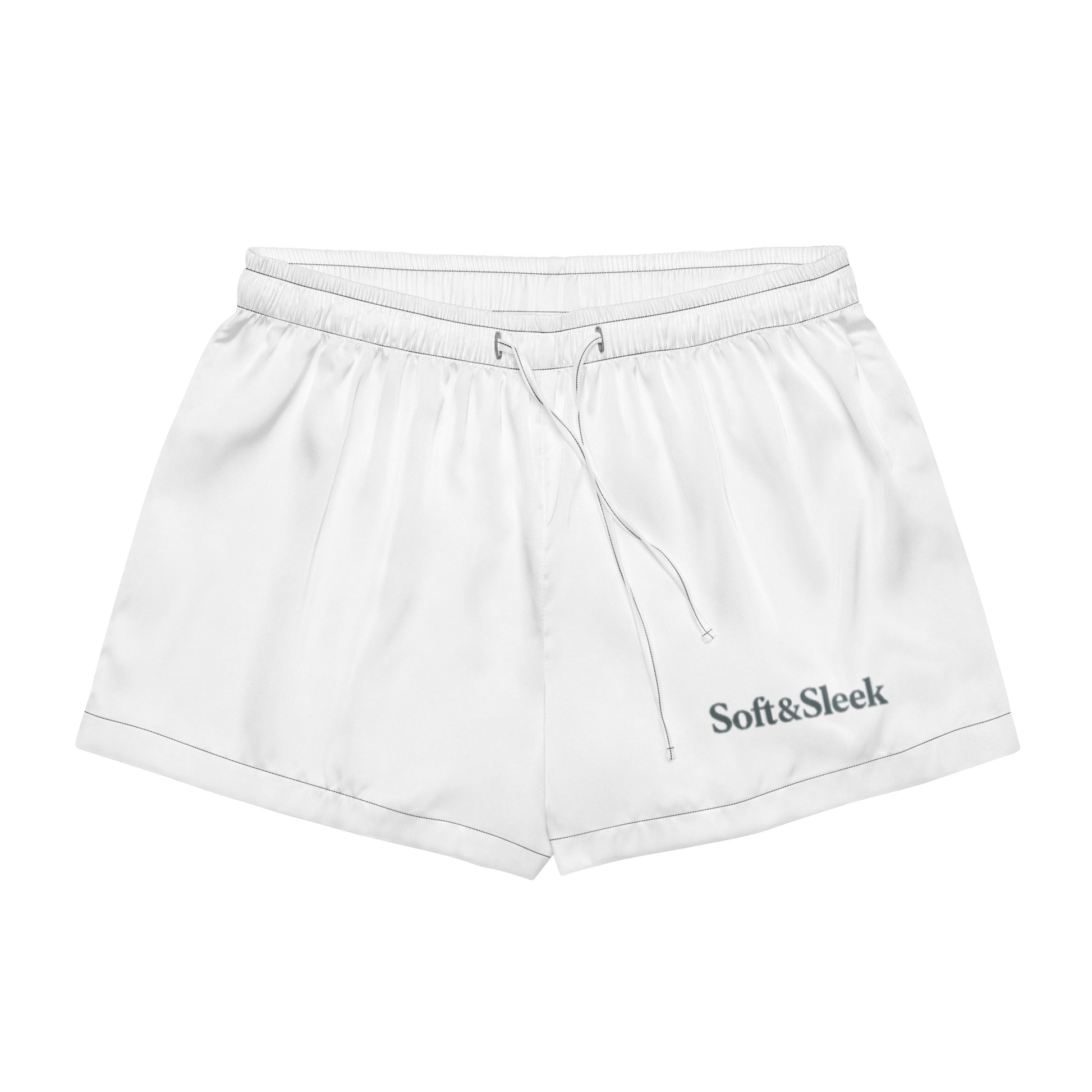 Flat lay of white Soft & Sleek shorts with front-facing view, drawstring and logo visible on the leg.