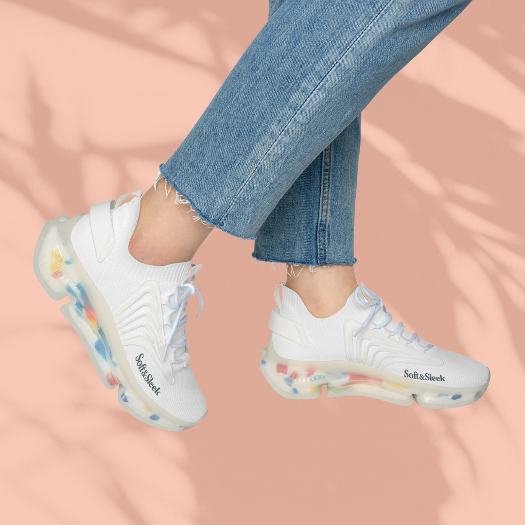 White sneakers with colorful sole on a peach background