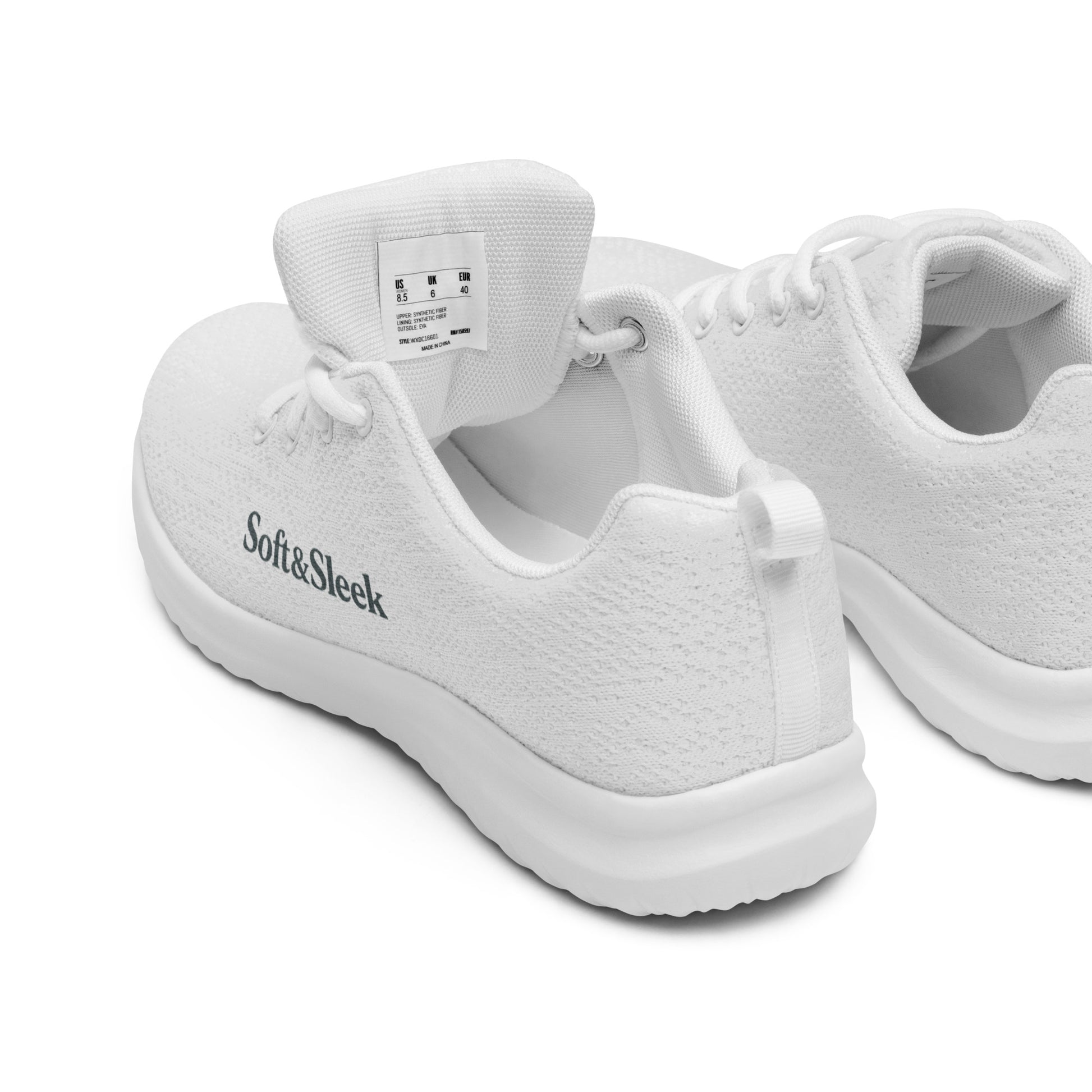 Close-up of a pair of white Soft & Sleek sneakers, one tilted to show branding and inner label.